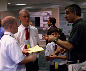 ARM user Eugene Clothiaux graciously agreed to be interviewed by St. Mark Catholic School 8th graders, who participated in the meeting's poster session.