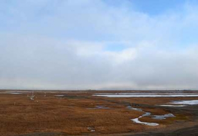 ARM-ACME V researchers are studying populations of liquid droplets and ice crystals in clouds such these seen above the arctic tundra at the ARM Facility at Oliktok Point.