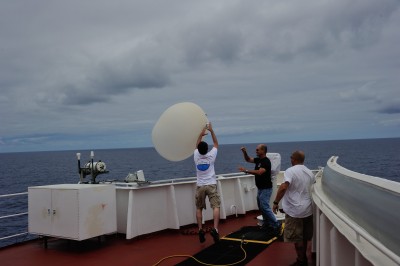Weather balloon launch over ship’s wing. Far left: Trevor Ferguson