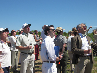 (Far right with bow tie) Principal investigator Larry Berg watches a sonde launch at TCAP while giving a tour to the opening ceremony visitors.