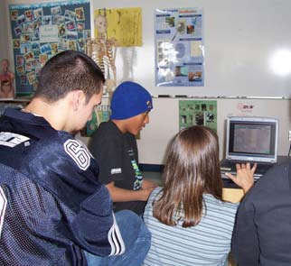 A biology class at Barrow High School follows along as their teacher checks out the North Slope of Alaska DVD archive. 