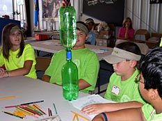 Kids attending the Chickasaw Nation Aviation and Space Camp learned to decode station model plots, contour temperature maps, create tornadoes in a bottle (shown above), and build wind-resistant houses.