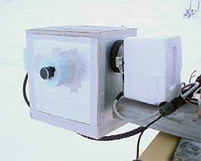 About the size of a toaster, the MAX-DOAS instrument system at Atqasuk is well-insulated to protect it from the Arctic cold.  As the unit rotates on its side axis, measurements are obtained through the optical inlet.