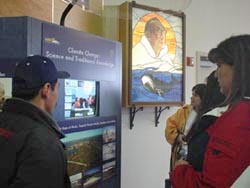 Community members check out the interactive climate kiosk at its permanent home in the Iñupiat Heritage Center in Barrow, Alaska.