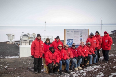 AWARE team members pause for a moment after a successful completion of installation of the second ARM Mobile Facility at McMurdo Station.