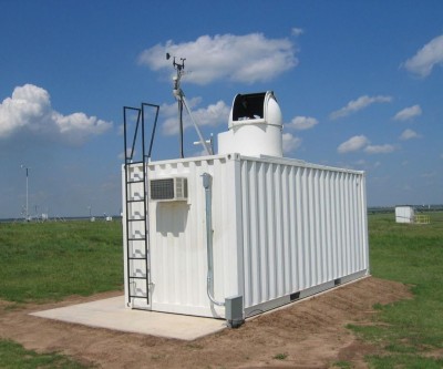 A camera, weather station, and sun tracker with a protective dome are located on the roof of the fully automated FTS mobile laboratory. Inside the shelter, the spectrometer receives the reflected solar beam from the sun tracker, while the main computer system operates all the instruments and acquires the data.