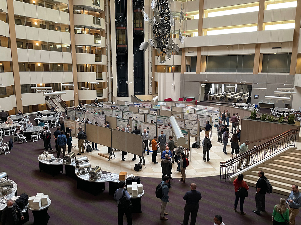 A wide view of a poster session inside the Rockville Hilton