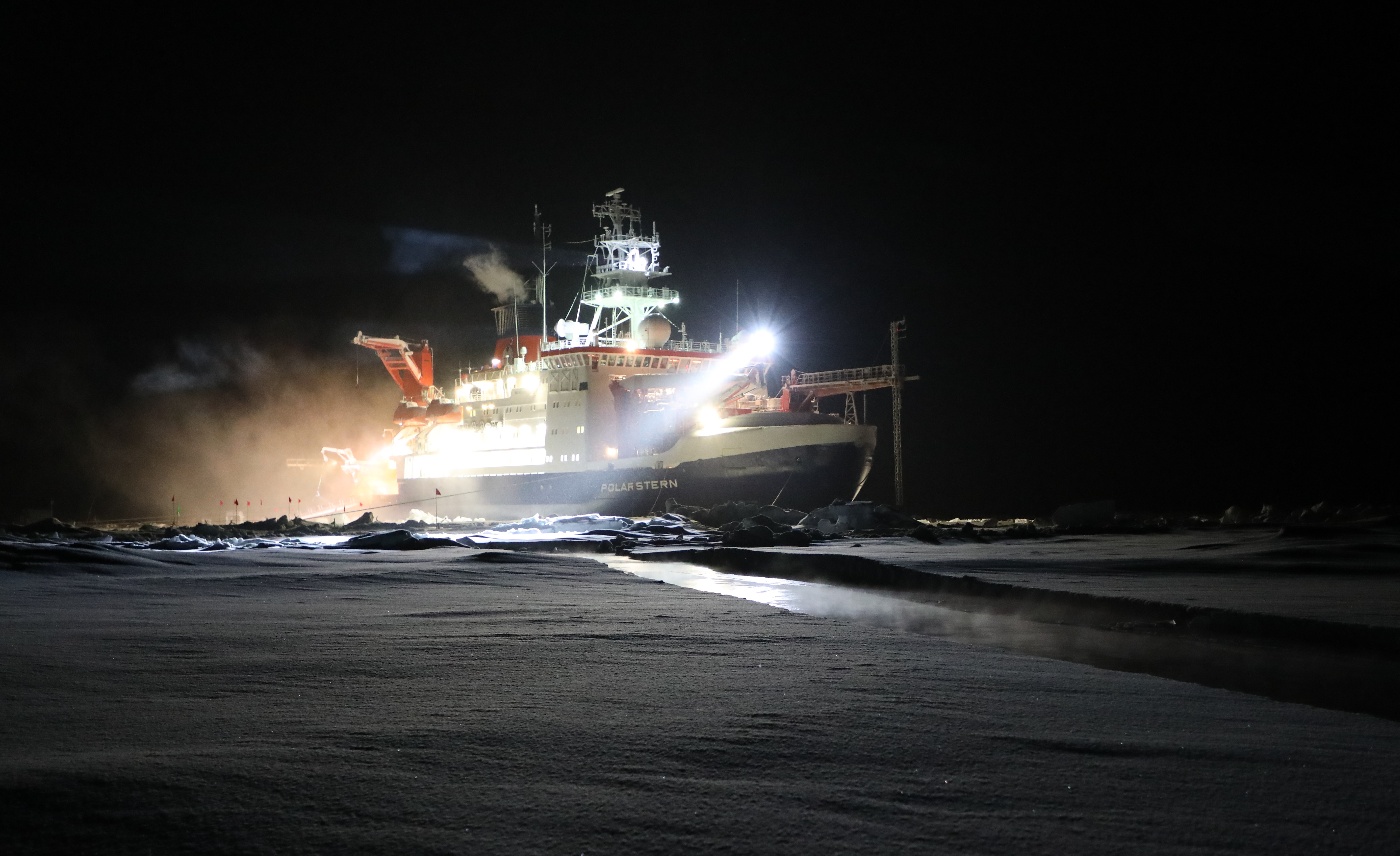 The R/V Polarstern icebreaker sits during polar night in the ice as part of the MOSAiC expedition