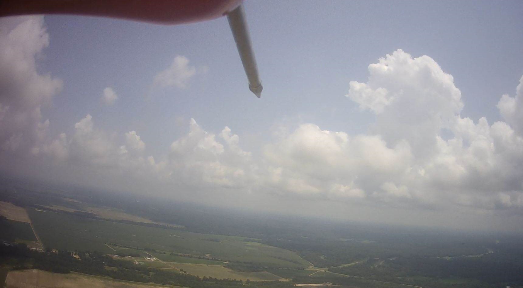 Aerial shot from TigerShark XP UAS looks straight ahead at clouds