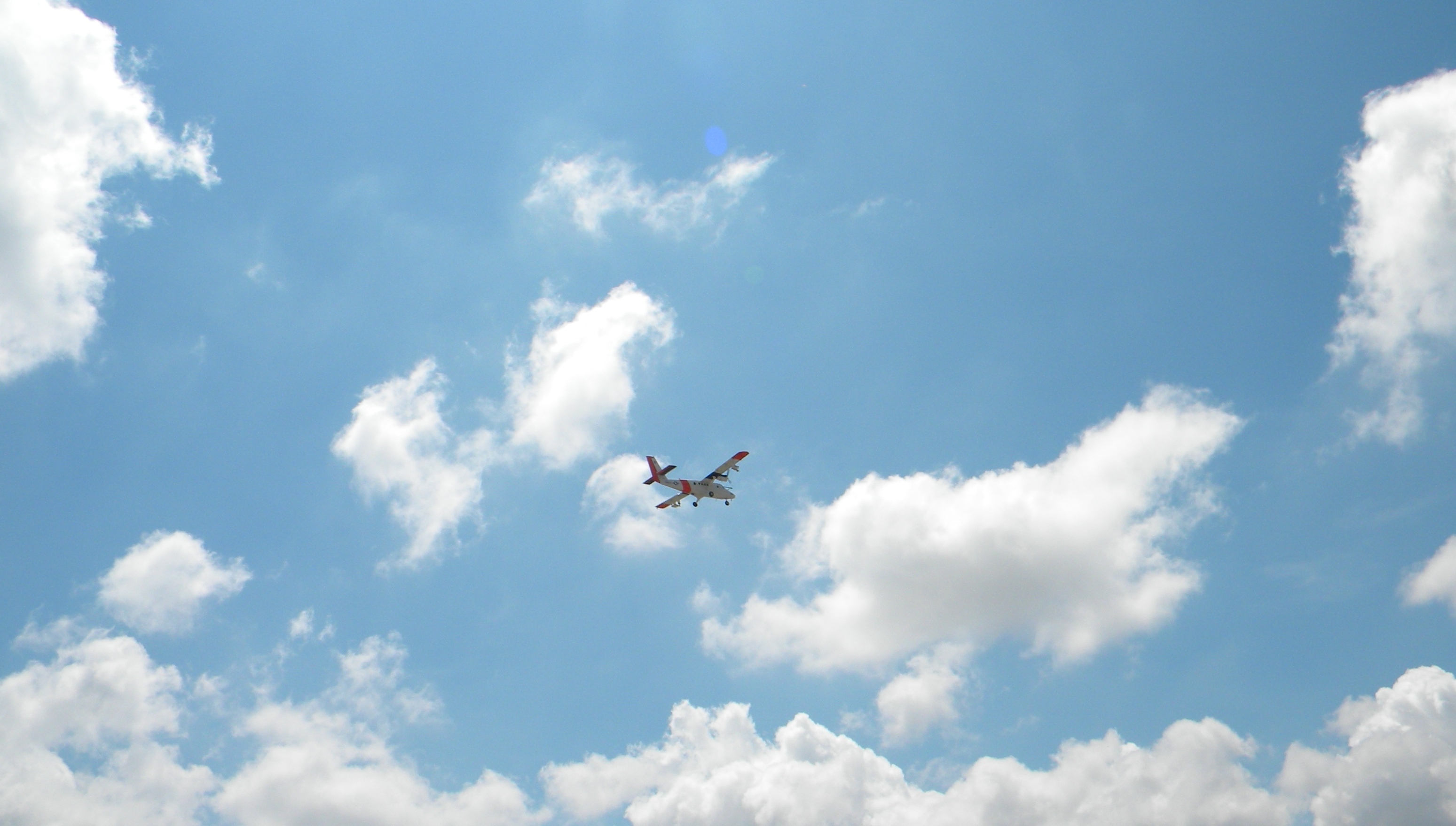 cumulus clouds and plane