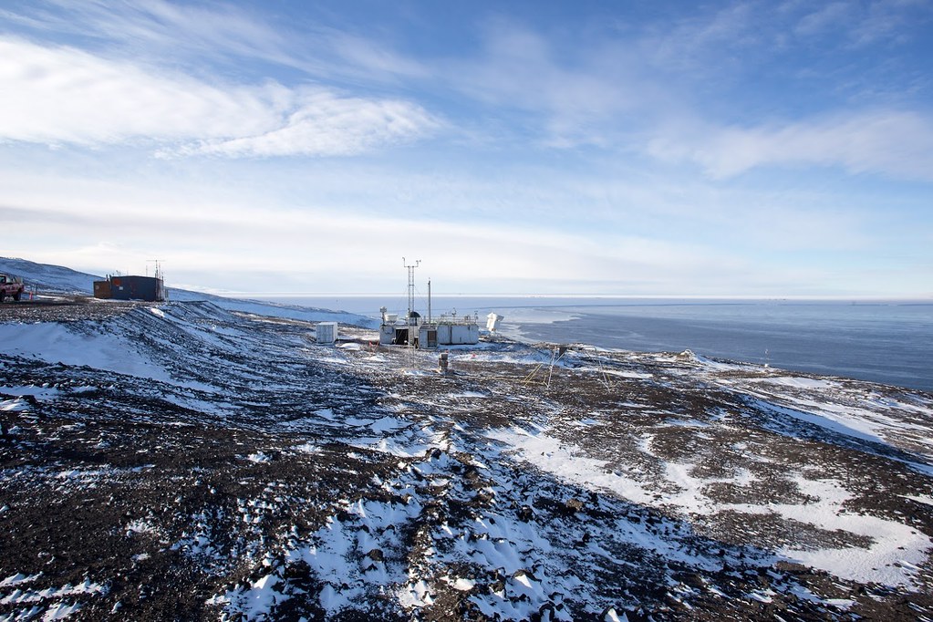 The ARM Mobile Facility sits on a shoreline covered by snow.