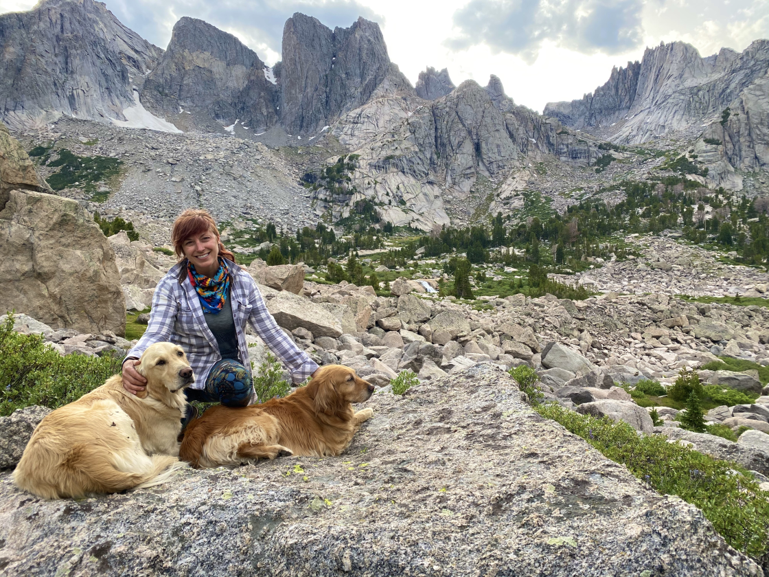 Jessie Creamean poses with her dogs in Wyoming's Wind River Range.