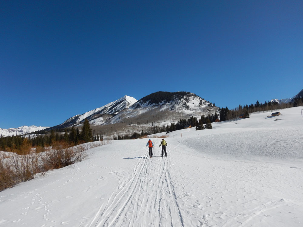 Steve Jennison and John Bilberry ski on Gothic Road during SAIL site visit