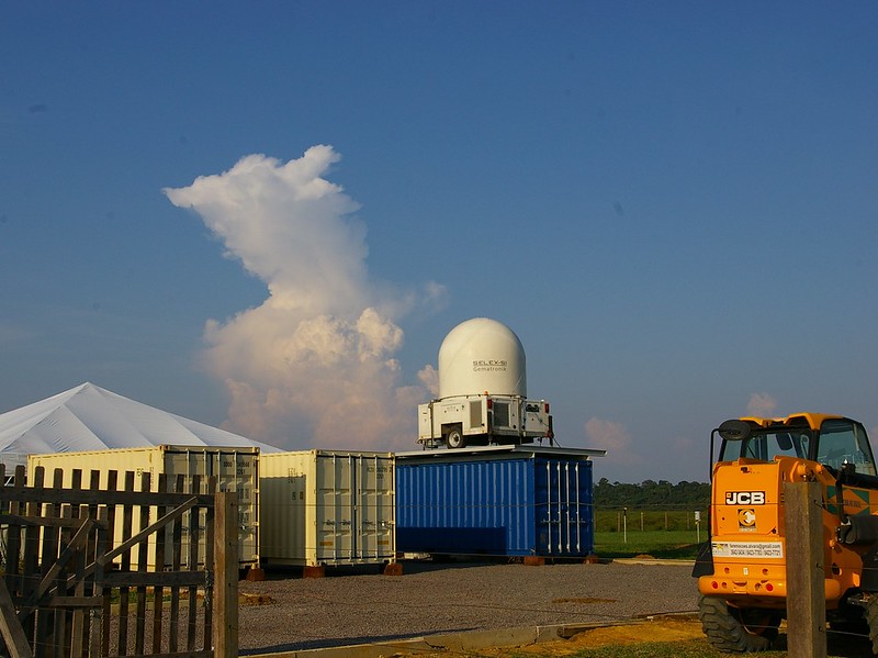 A CHUVA radar sits on top of a container.