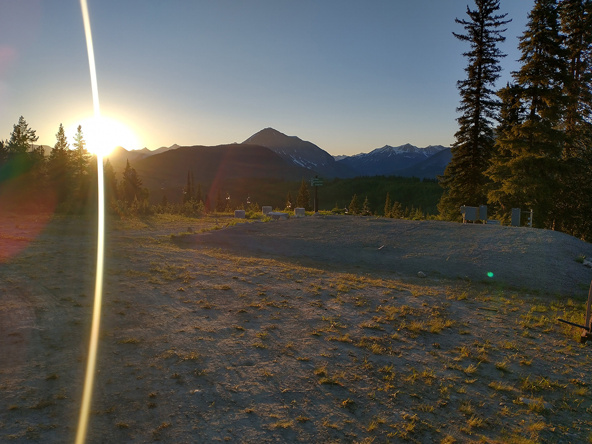 The sun drops behind the mountains, with the last bits of light illuminating where the AOS and X-band radar used to stand for SAIL.