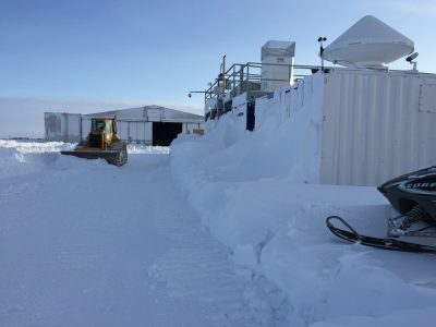 A plow moves snow from around the third ARM Mobile Facility during winter conditions. (File photo courtesy of Sebastian Biraud.)