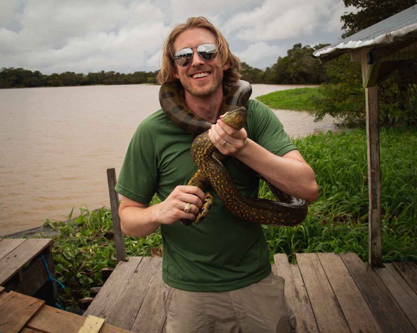 Jason Tomlinson with an anaconda in Brazil
