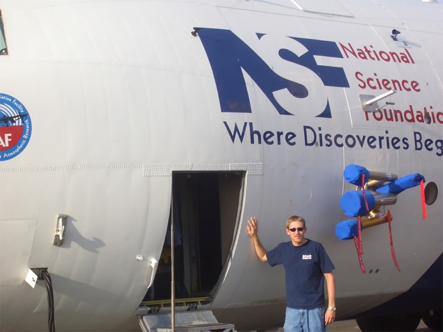 Jason Tomlinson with a C-130 research aircraft