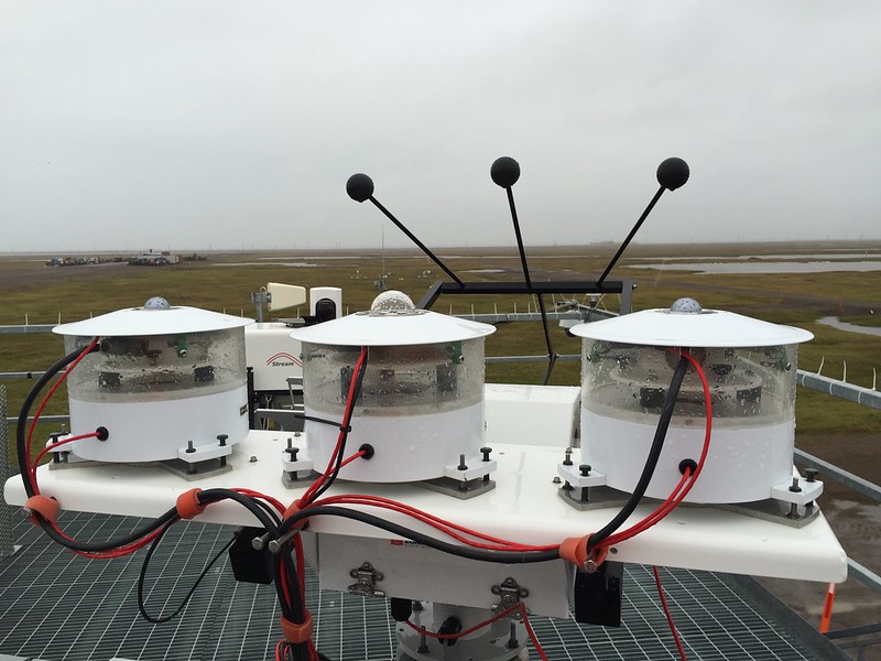 Radiometers in overcast conditions at Oliktok Point, Alaska, with tundra stretching out across the horizon