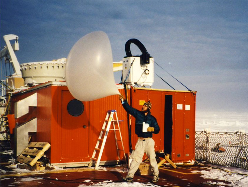 Matthew Shupe prepares to launch a weather balloon in the Arctic.