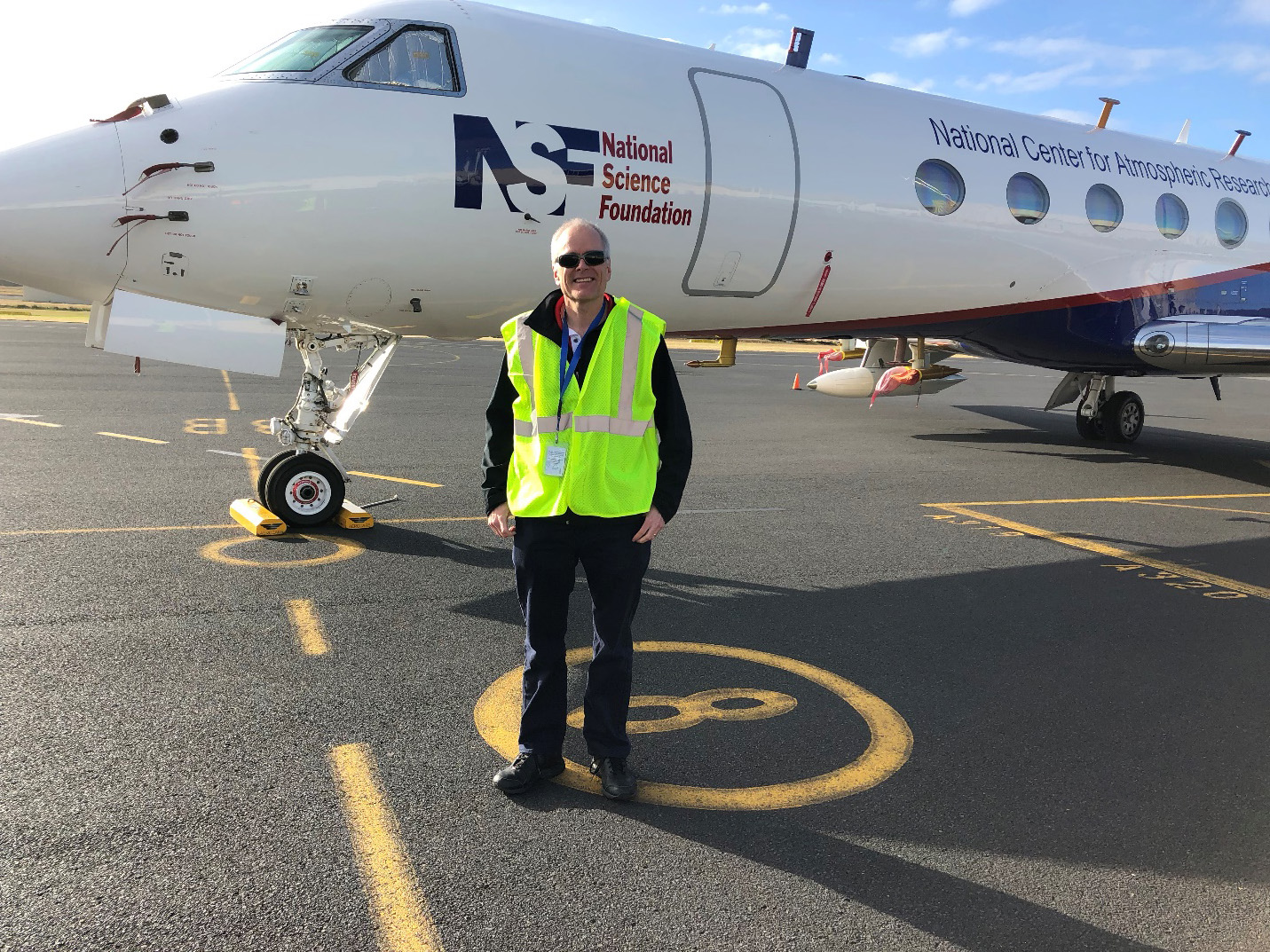 Greg McFarquhar in front of airplane