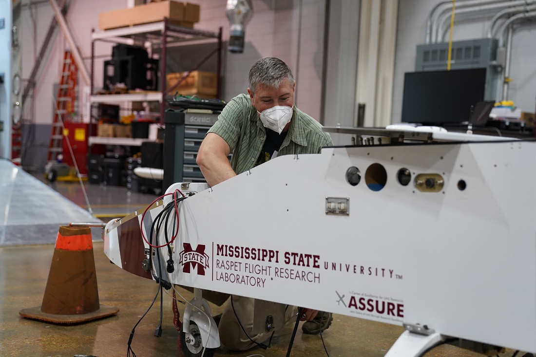 Matt Newburn works to integrate instrumentation into an uncrewed aerial system.