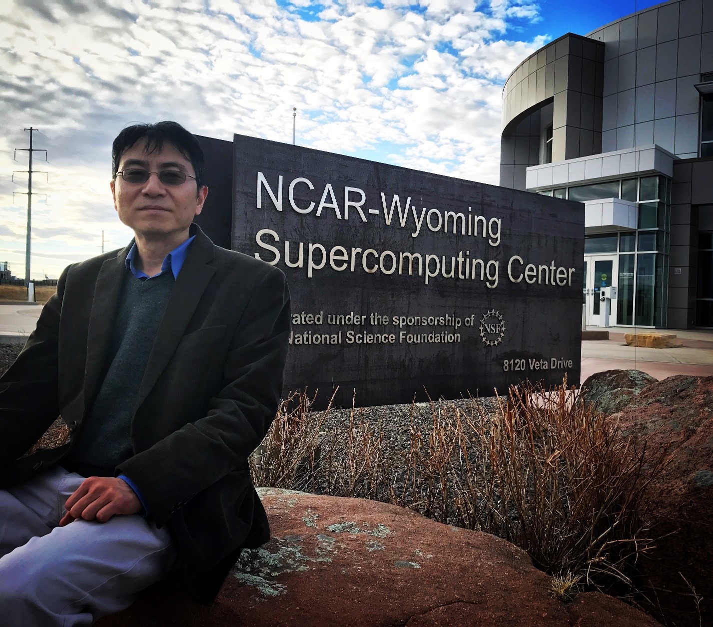 Xiaohong Liu poses outside in Wyoming