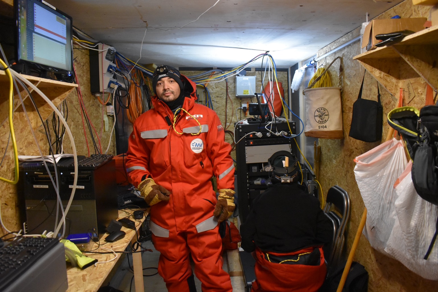 Vagner Castro stands inside a shelter installed on the sea ice during MOSAiC