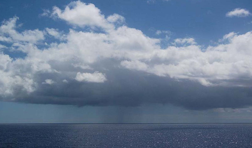 Stratocumulus clouds hover over the ocean